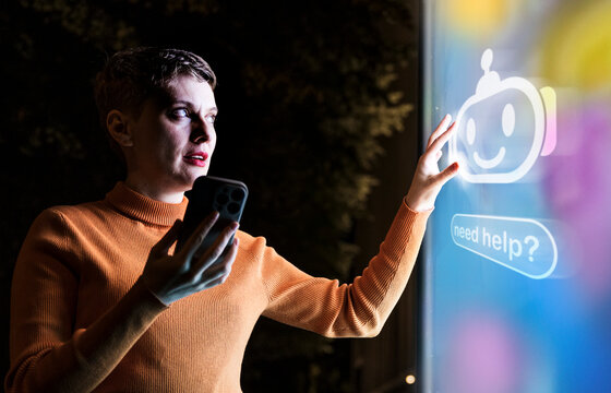Woman touches a glowing chatbot screen at night in the city