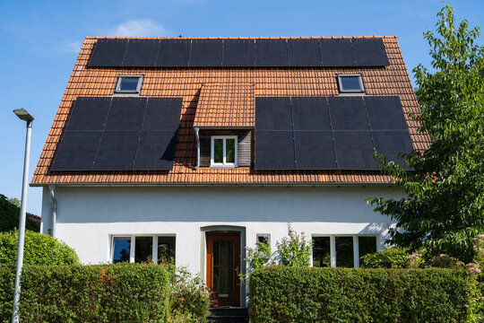 Old dwelling house with solar panel on the roof in Soest Germany