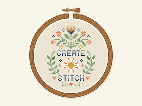 Cross stitch embroidery design with flowers and text create stitch in a wooden hoop.