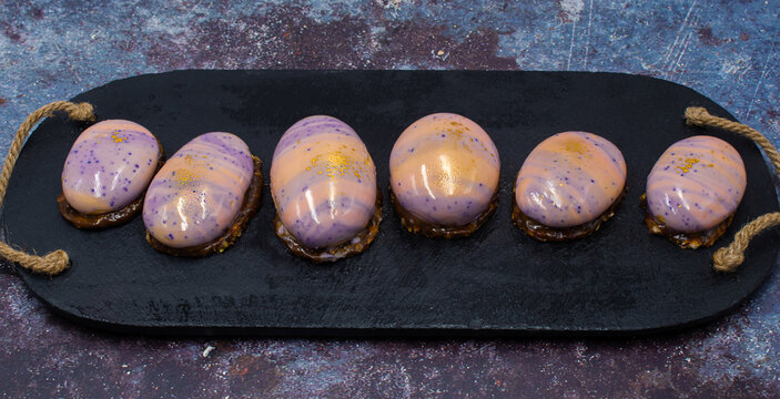 River rock shaped dessert: mango coconut entremets, mini portions. 