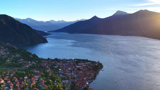 Panoramic view of Lake Como in Italy at sunrise with Menaggio historic town on the shores of the lake. Tourism in Lombardy, Italy