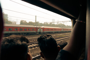View of railway tracks from a crowded Mumbai train