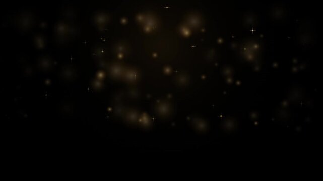 Golden glitter particles and bokeh lights on black background motion video