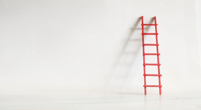 Creativity,innovation,career, idea,thinking out of the box concept, white wall with ladder of success. Large free copy space,negative space technique