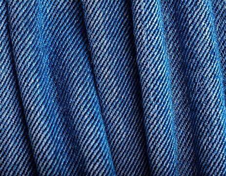 detailed blue denim fabric texture showing visible twill weave pattern and indigo fibers wallpaper background image