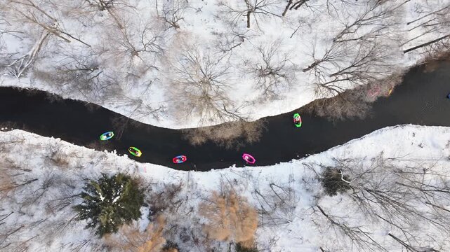 Colorful Kayaks on Snowy River Winter Aerial