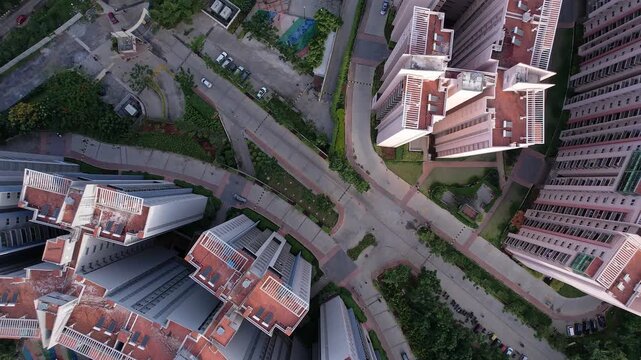 Drone high angle top view of modern high rise residential towers highlighting architecture density
