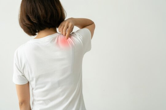 Woman touching her shoulder with pain isolated on white background