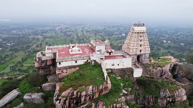 Cinematic drone view of Melkote historical temple and surrounding scenic landscape with heritage beauty