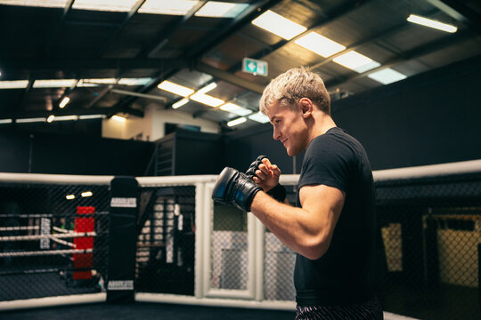MMA fighter in training inside a ring