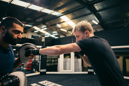 Athlete practicing strikes in MMA gym