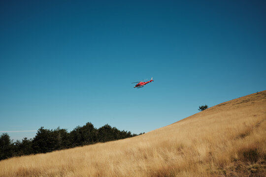 Helicopter flying in the mountains