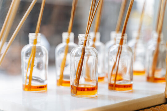 Glass bottles with fragrance oil and reed sticks