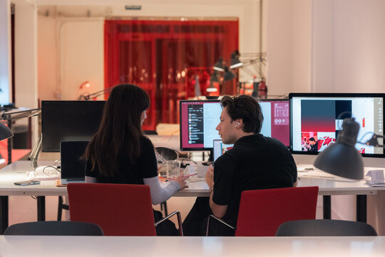 Designers talking at office