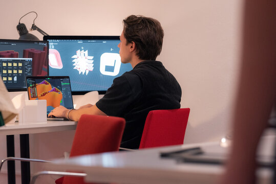 Designer making 3d model of object on computer