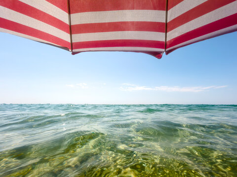 Wide Sea Horizon Under Beach Umbrella