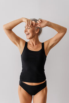 Person laughing enjoying natural beauty and aging gracefully