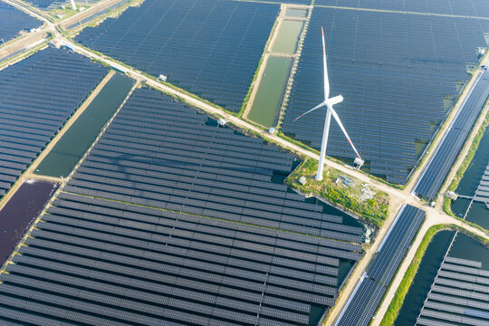 vast floating solar farm and wind turbines over water