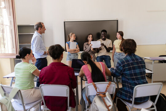 Students presenting global warming climate change project in classroom