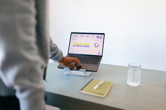 Business Laptop With Analytics Dashboard On Desk