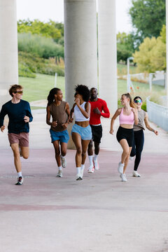 Fitness community gathered outdoors to practice jogging in a park