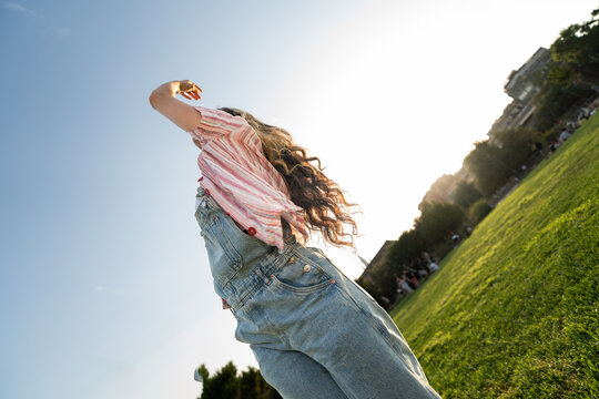 Woman dances in park