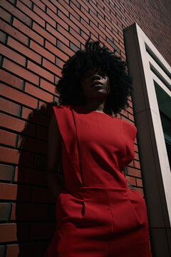 Low angle fashion portrait with modern architecture