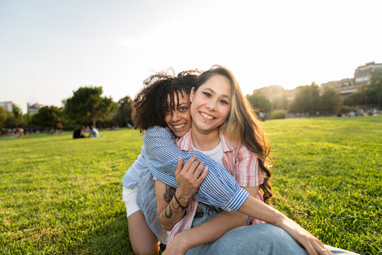 Happy Friends Hugging Outdoors