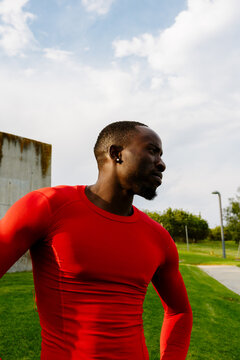 Medium shot of an athletic man in sportswear with a confident posture