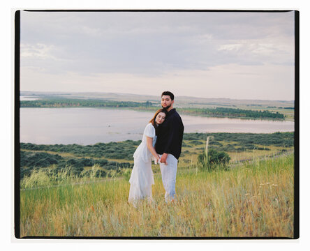 Portrait of Young Couple by Lake
