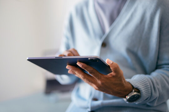 Businessperson Using Tablet at Office