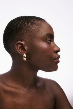 Profile View of a Person With Short Hair and Earrings