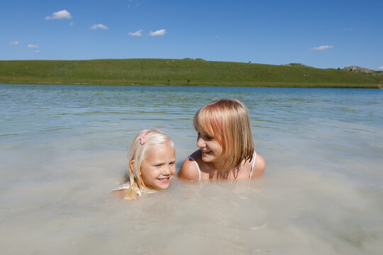 Happy children in the lake