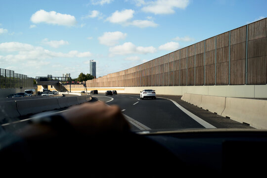Driving on a Busy Highway Under a Clear Blue Sky
