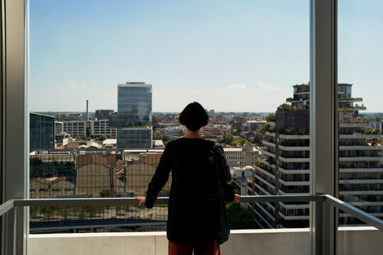 Person Looks at City From High Building