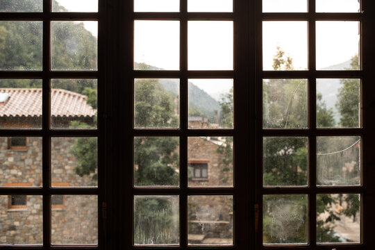 Wooden window overlooking a mountain village