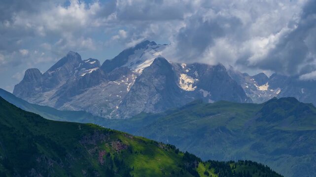 Majestic Snow-Capped Mountain Peaks Over Lush Valleys