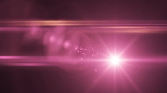 Cinematic pink anamorphic lens flare transitioning to central light burst on dark background.