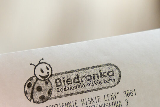 Warsaw, Poland - Sep 5, 2026: Biedronka logo printed on a shop receipt showing the retail chain branding and store address