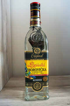 Warsaw, Poland - Sep 5, 2026: Bottle of Spisska Borovicka juniper spirit standing on a stone countertop against a plain wall in an indoor setting