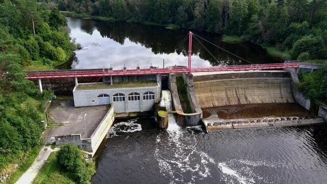 aerial view, drone footage, river, clouds reflection, dark water, dam, hydroelectric, power plant, red bridge, infrastructure, spillway, water surface, texture, pattern, backg