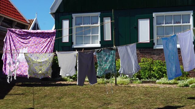 Laundry drying outside a traditional wooden house in Marken