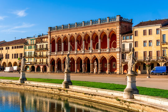 beautiful city view of an urban landscape with park chanel with blue water and monuments and historic european buildings on background. Autumn season city landscape