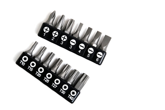 Set screwdriver bits in black holders, showing Torx, Phillips, and flat heads on white background.
