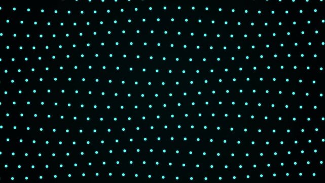 This looping tech background displays a grid of glowing cyan dots for digital overlays.