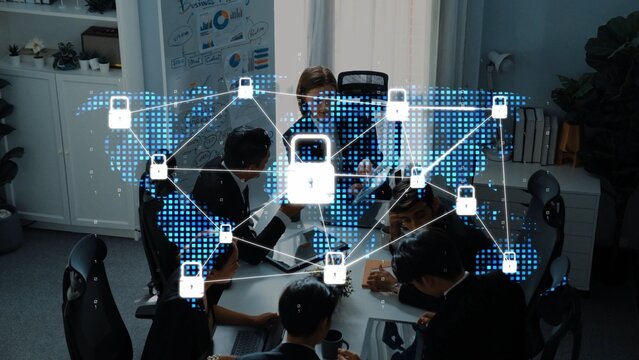 A diverse team collaborates in a modern office setting, focusing on digital security and protection, with lock symbols overlaid on a connected globe. Raster