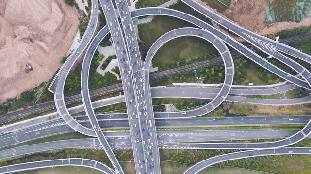 Aerial View of Multi Level Highway Interchange With Heavy Traffic