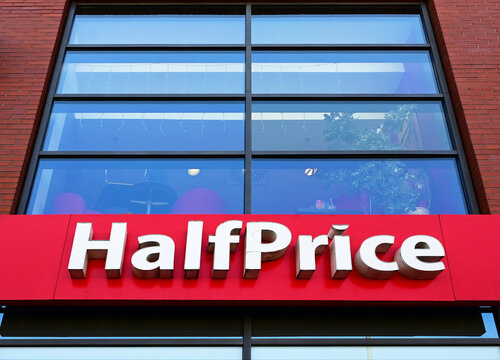 Ł&oacute;dź, Lodz, Poland, Europe - 08.2026 : Logo of HalfPrice branded clothing and footwear outlet chain owned first by CCC now by Modivo, integrated omnichannel platform, Ł&oacute;dź Gallery shopping center