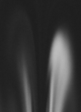 Abstract dark gray gradient fabric texture with light reflection for elegant background.