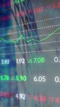 Composite video of stock market data processing against tall buildings in background